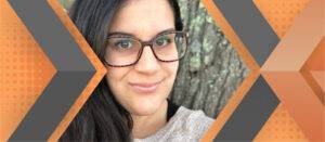 Portrait of Tabitha Cavalieri framed by an orange and gray geometric background.