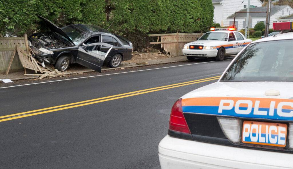 Car accident with property. Police on the scene.