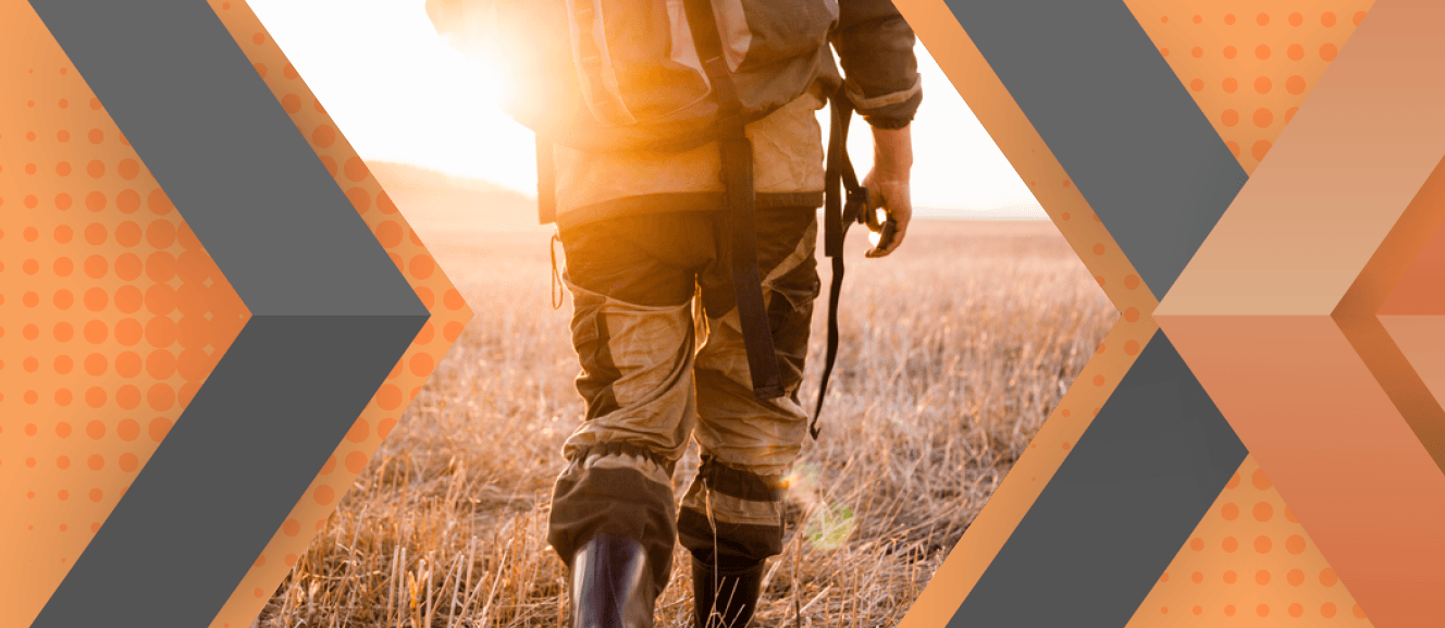 Portrait of Charles Cardella framed by an orange and gray geometric background.